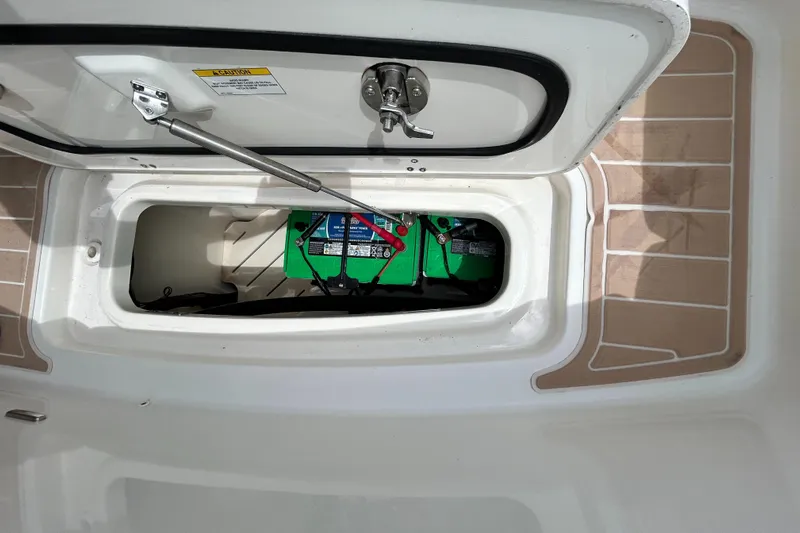  Yacht Photos Pics 2017 Boston Whaler 320 Vantage battery compartment with green batteries and secure latch.