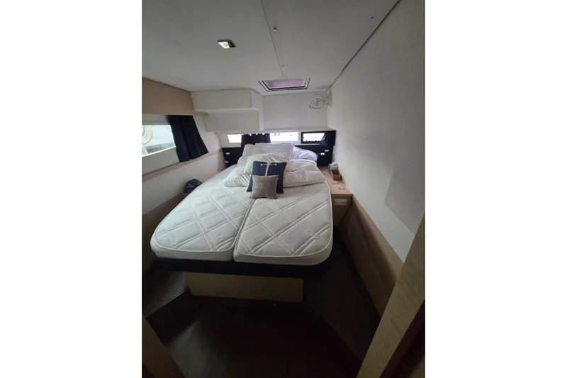 Sol Mates Yacht Photos Pics Cozy cabin interior of 2018 Fountaine Pajot SABA 50 yacht with comfortable bedding.
