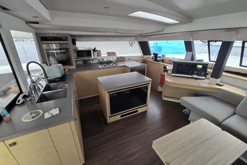 Sol Mates Yacht Photos Pics Modern kitchen interior of 2018 Fountaine Pajot SABA 50 catamaran with sleek appliances.