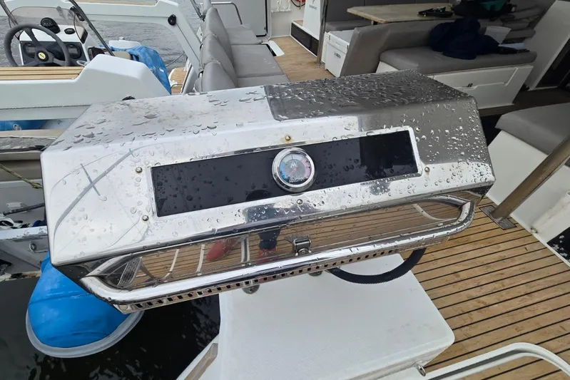 Sol Mates Yacht Photos Pics Stainless steel grill on 2018 Fountaine Pajot SABA 50 yacht deck, wet with raindrops.