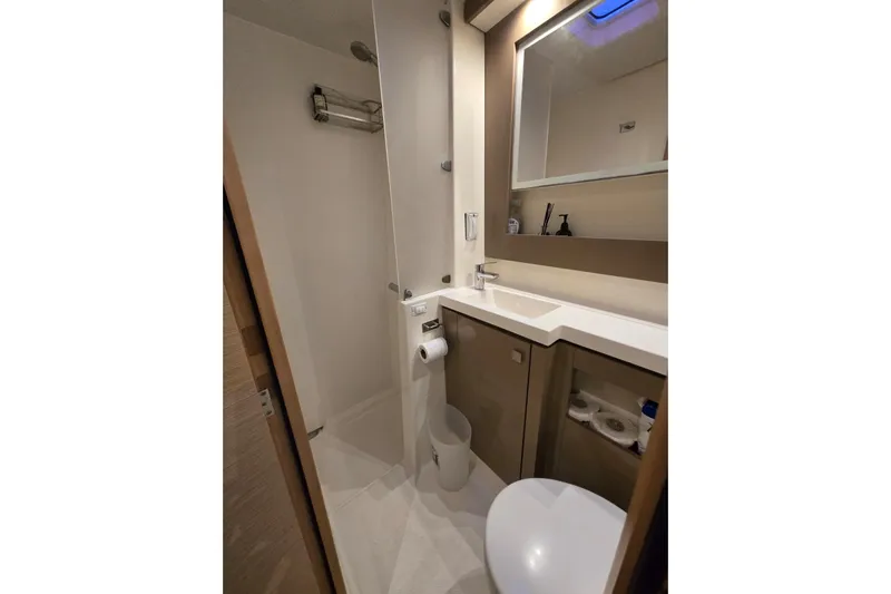 Sol Mates Yacht Photos Pics Modern bathroom in 2018 Fountaine Pajot SABA 50 yacht, featuring sleek design and amenities.