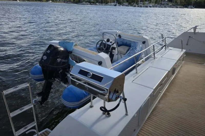 Sol Mates Yacht Photos Pics 2018 Fountaine Pajot SABA 50 yacht with dinghy and outboard motor on deck.