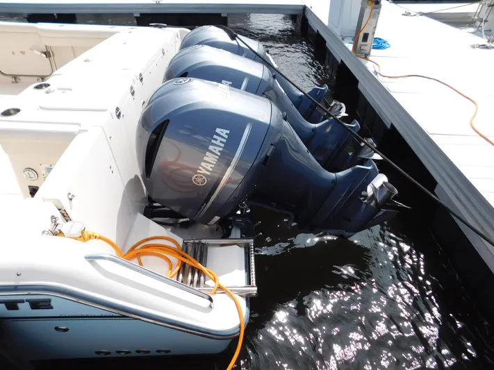 Here & Now Yacht Photos Pics 2018 Grady-White Freedom 375 with triple Yamaha outboard engines at dock.