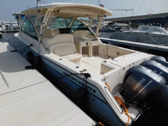 Here & Now Yacht Photos Pics 2018 Grady-White Freedom 375 boat docked, featuring spacious seating and twin Yamaha engines.