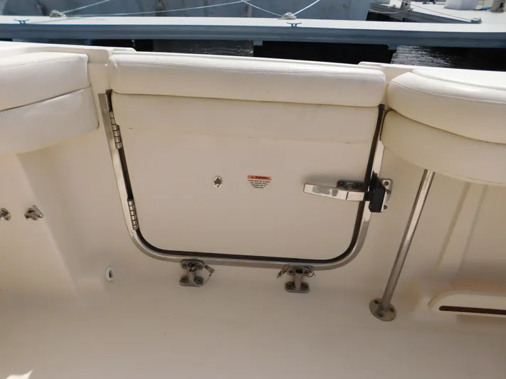 Here & Now Yacht Photos Pics 2018 Grady-White Freedom 375 boat interior with white seating and stainless steel fittings.