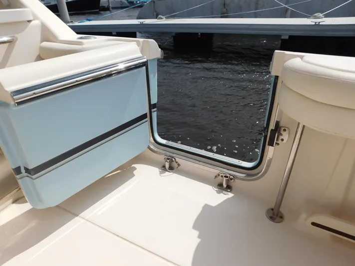 Here & Now Yacht Photos Pics 2018 Grady-White Freedom 375 boat interior, open door to water view.