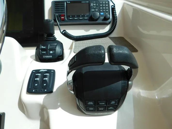 Here & Now Yacht Photos Pics Control panel of 2018 Grady-White Freedom 375 boat with Yamaha throttle and radio.