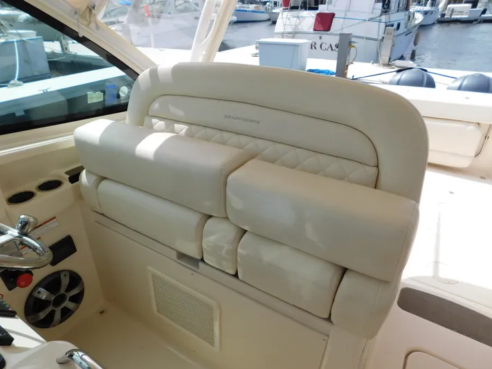 Here & Now Yacht Photos Pics 2018 Grady-White Freedom 375 boat interior with luxurious seating and control panel.