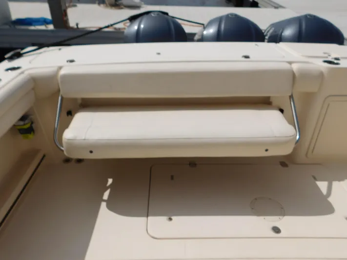 Here & Now Yacht Photos Pics 2018 Grady-White Freedom 375 boat seating area with foldable bench and storage.