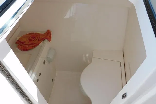  Yacht Photos Pics 2016 Pursuit DC 325 Dual Console interior cabin with storage and seating.