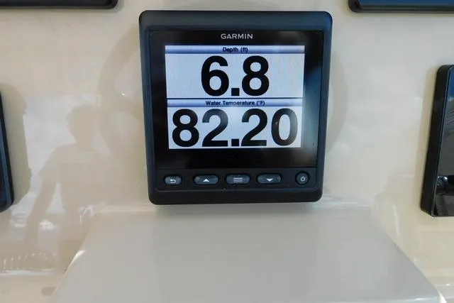  Yacht Photos Pics Garmin display on 2016 Pursuit DC 325 showing depth and water temperature.