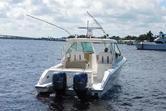  Yacht Photos Pics 2016 Pursuit DC 325 Dual Console boat on water with twin engines, scenic background.