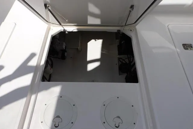  Yacht Photos Pics Open storage compartment on a 2016 Pursuit DC 325 Dual Console boat.