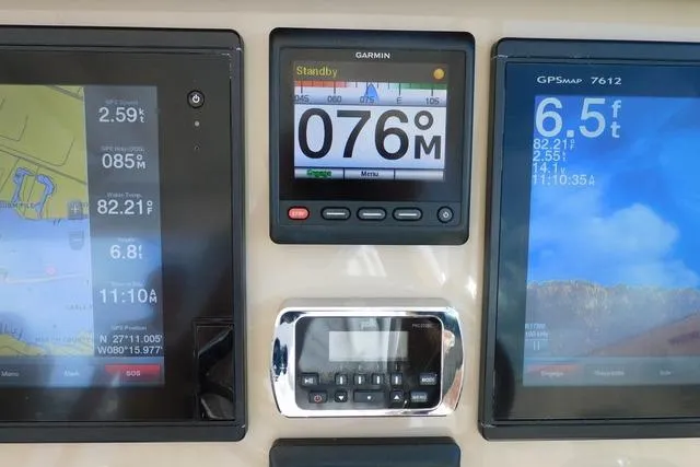  Yacht Photos Pics Dashboard of a 2016 Pursuit DC 325 Dual Console with Garmin navigation displays.