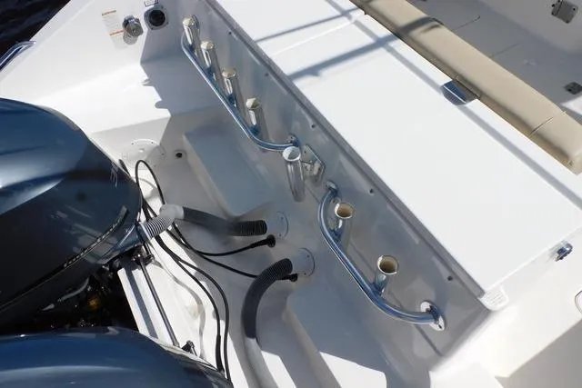  Yacht Photos Pics 2016 Pursuit DC 325 Dual Console boat deck with rod holders and engine view.