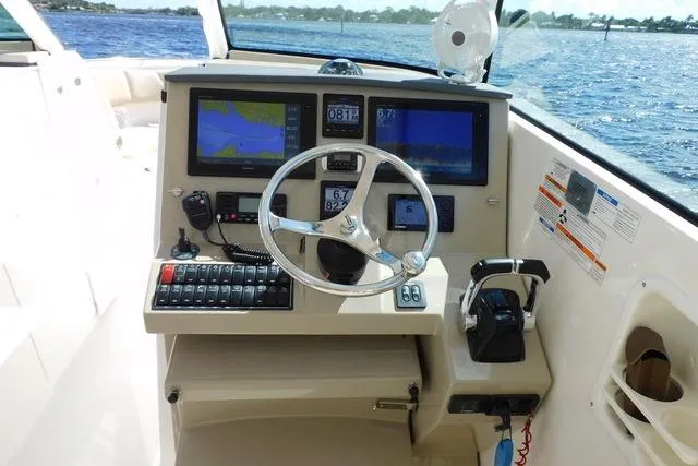  Yacht Photos Pics 2016 Pursuit DC 325 Dual Console helm with navigation screens and controls.