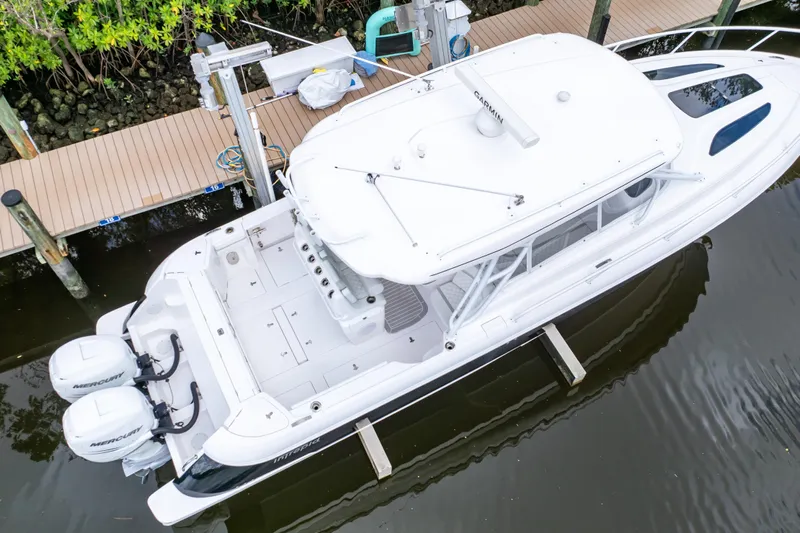  Yacht Photos Pics 2023 Intrepid 345 Valor boat docked, aerial view, featuring twin Mercury engines.