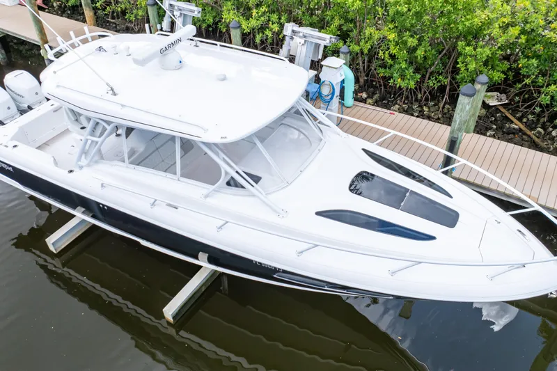  Yacht Photos Pics 2023 Intrepid 345 Valor boat docked, featuring sleek design and modern amenities.