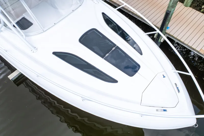  Yacht Photos Pics 2023 Intrepid 345 Valor boat docked, showcasing sleek white deck design and modern features.