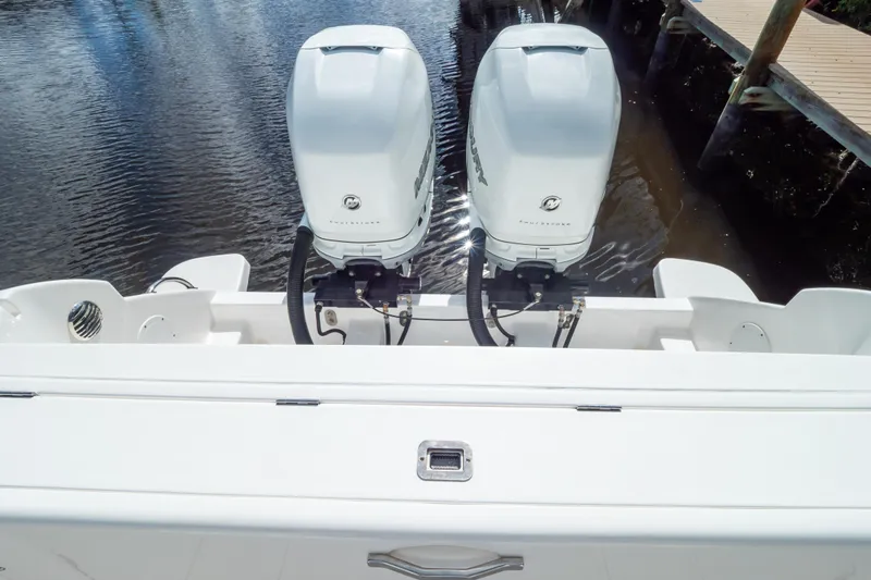  Yacht Photos Pics 2023 Intrepid 345 Valor boat with dual outboard engines on calm water.