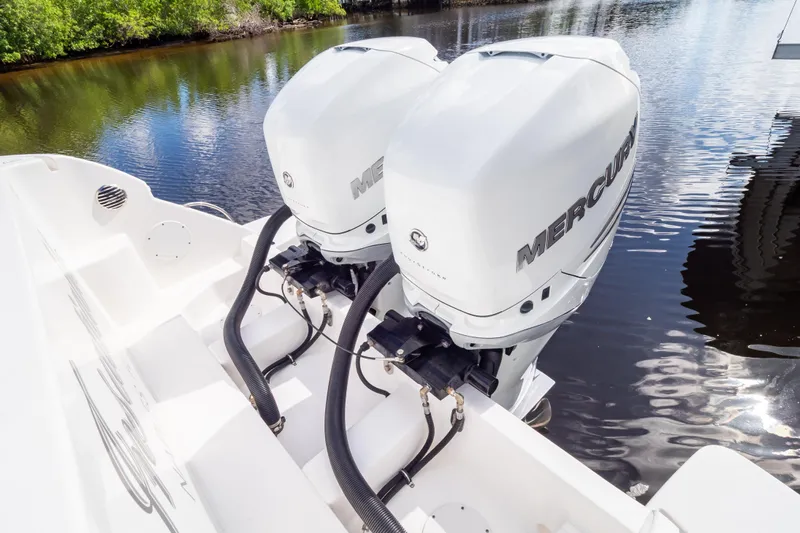  Yacht Photos Pics 2023 Intrepid 345 Valor with dual Mercury outboard engines on calm water.