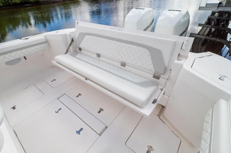  Yacht Photos Pics 2023 Intrepid 345 Valor boat with foldable seating and storage compartments.
