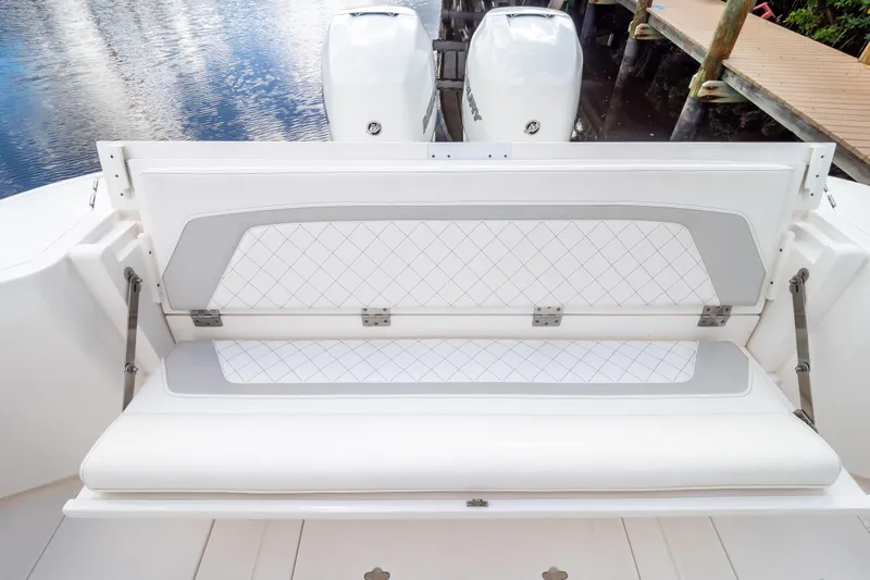  Yacht Photos Pics 2023 Intrepid 345 Valor boat with cushioned seating and dual outboard motors.