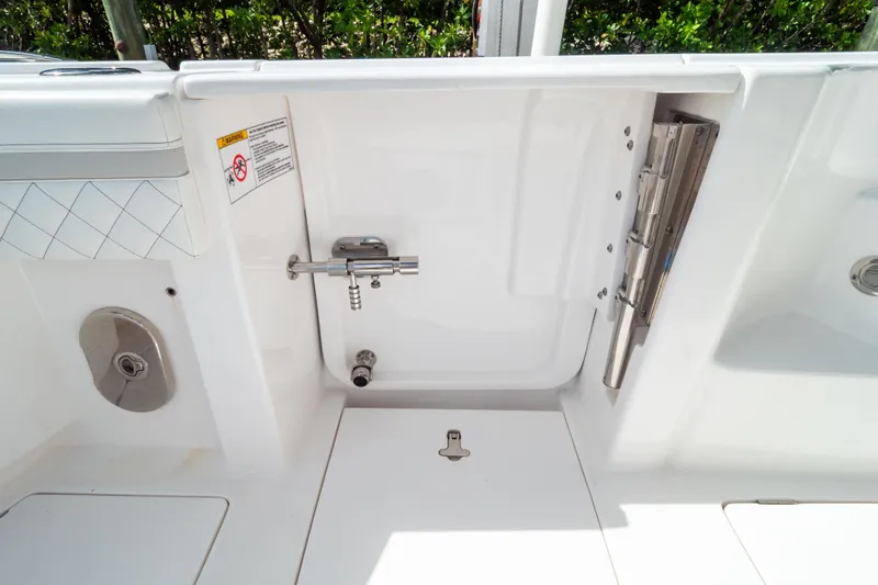  Yacht Photos Pics 2023 Intrepid 345 Valor boat interior with stainless steel fixtures and white finish.