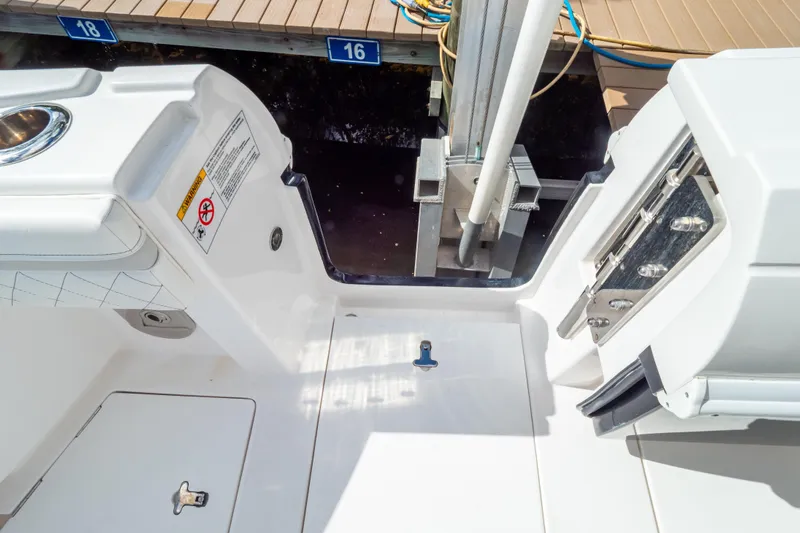  Yacht Photos Pics 2023 Intrepid 345 Valor boat deck with dock view and safety features.