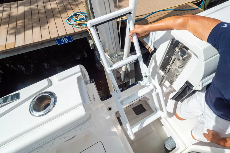  Yacht Photos Pics 2023 Intrepid 345 Valor boat with ladder and dock view.