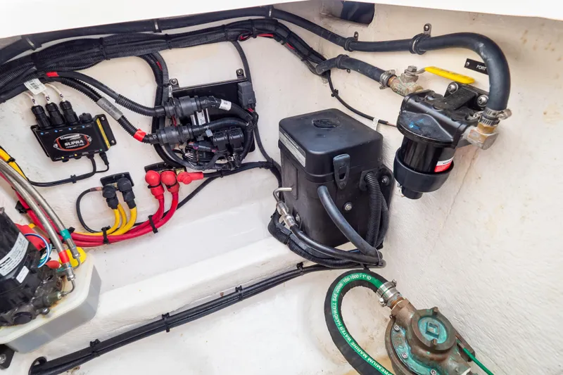  Yacht Photos Pics Engine compartment of 2023 Intrepid 345 Valor, showcasing wiring and mechanical components.