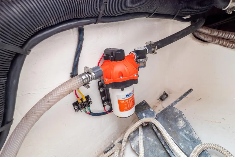  Yacht Photos Pics 2023 Intrepid 345 Valor water pressure pump system with hoses and wiring.