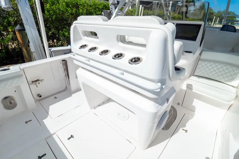  Yacht Photos Pics 2023 Intrepid 345 Valor boat interior with sleek white seating and modern design.