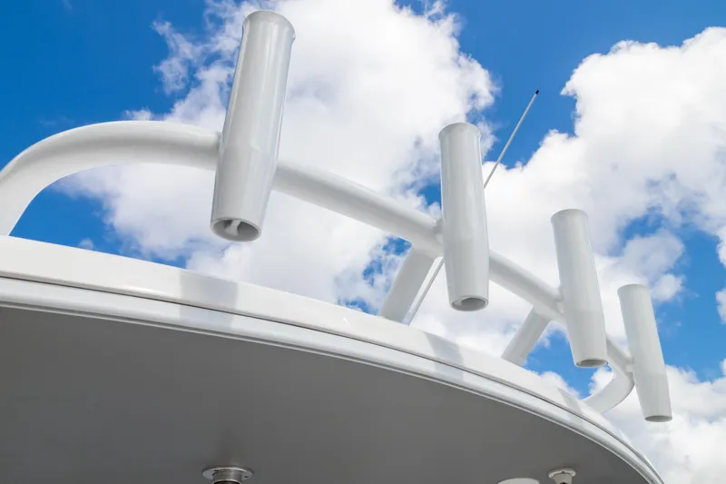  Yacht Photos Pics 2023 Intrepid 345 Valor boat with rod holders against a blue sky.