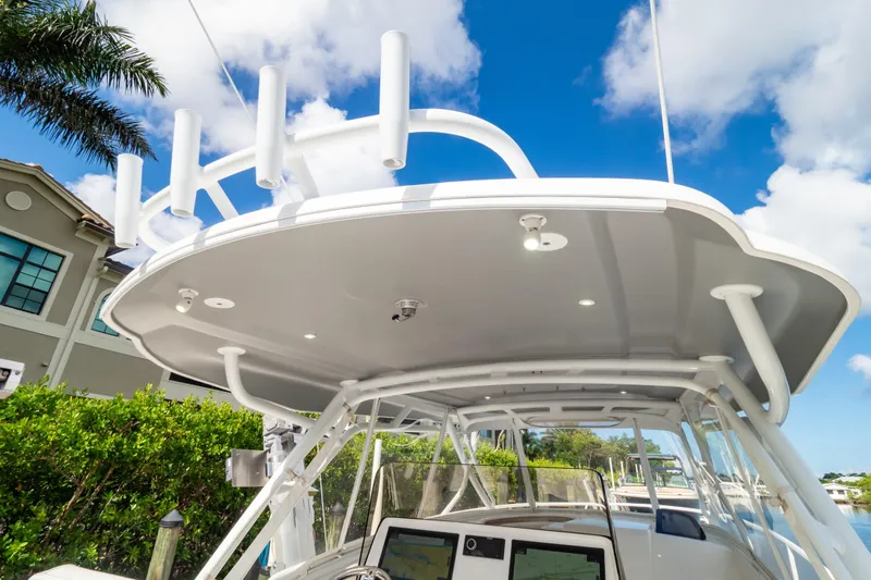  Yacht Photos Pics 2023 Intrepid 345 Valor boat with sleek canopy and modern navigation system.