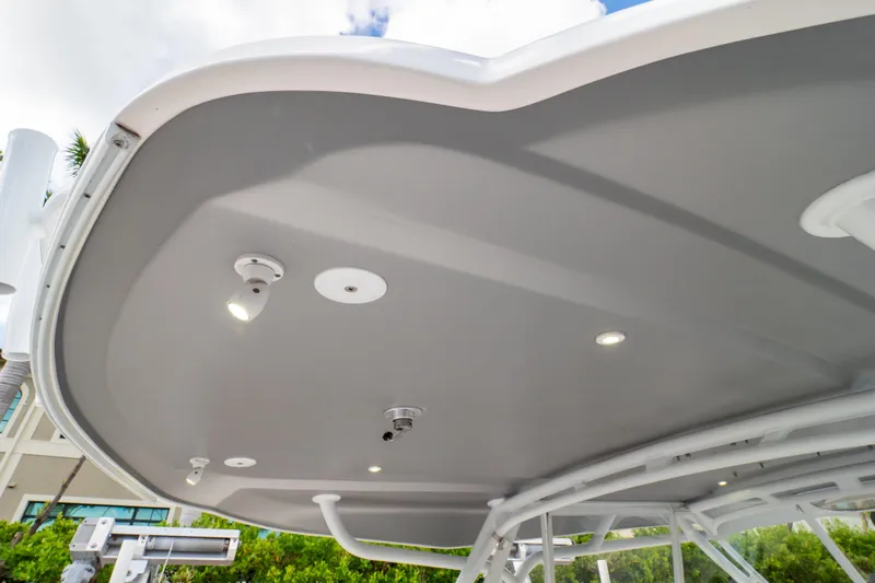  Yacht Photos Pics 2023 Intrepid 345 Valor boat canopy with integrated lighting and sleek design.