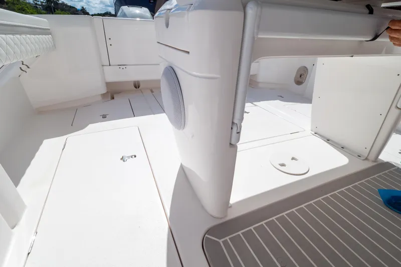  Yacht Photos Pics 2023 Intrepid 345 Valor boat interior with sleek white design and spacious layout.