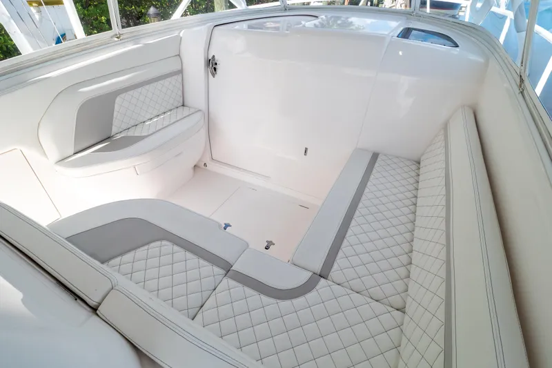  Yacht Photos Pics 2023 Intrepid 345 Valor boat interior with luxurious white quilted seating.
