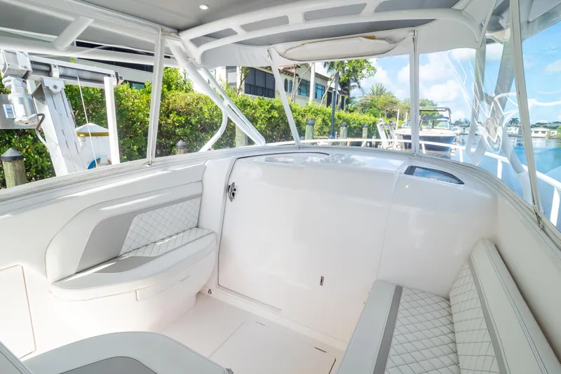  Yacht Photos Pics 2023 Intrepid 345 Valor boat interior with white seating and modern design.