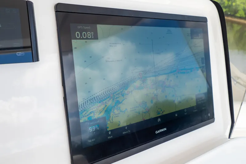 Yacht Photos Pics Garmin navigation display on 2023 Intrepid 345 Valor boat, showing GPS speed and map.