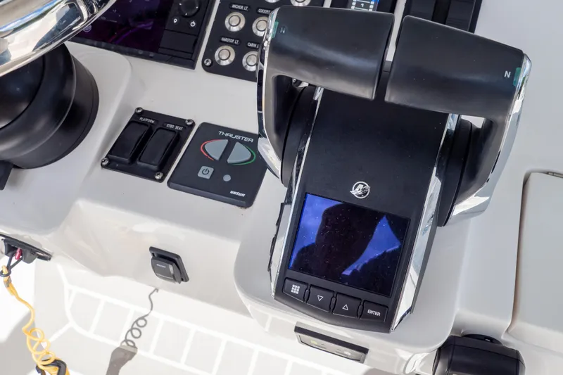  Yacht Photos Pics Control panel of 2023 Intrepid 345 Valor boat with throttle and navigation controls.