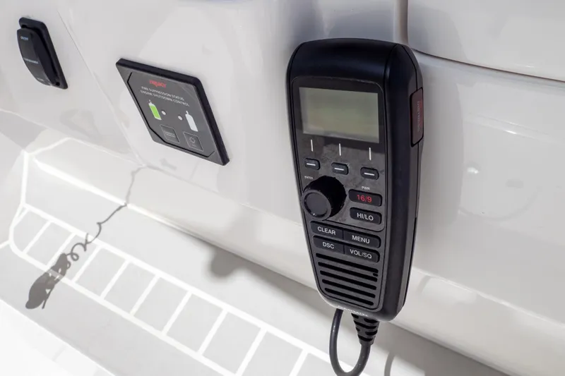  Yacht Photos Pics 2023 Intrepid 345 Valor boat communication system with control panel and radio handset.
