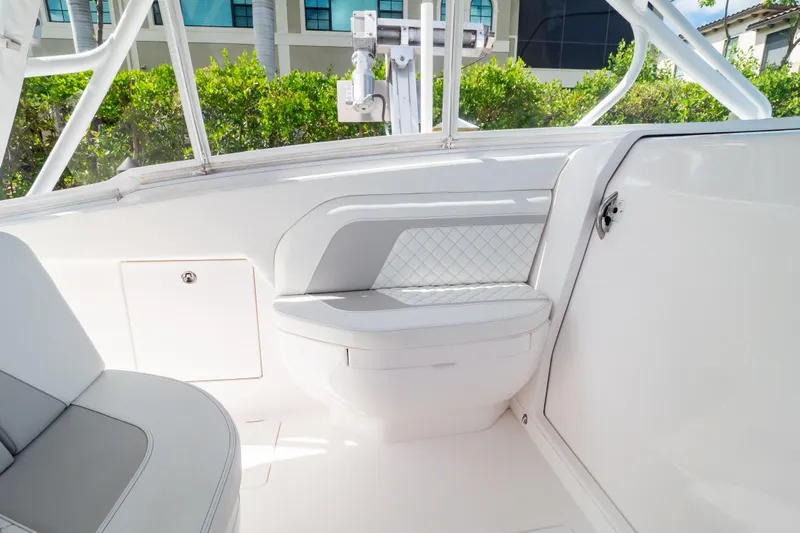  Yacht Photos Pics 2023 Intrepid 345 Valor boat interior with white seating and sleek design.