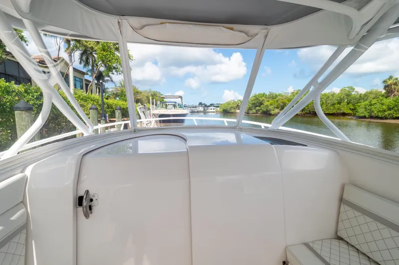  Yacht Photos Pics 2023 Intrepid 345 Valor boat interior with scenic waterway view.