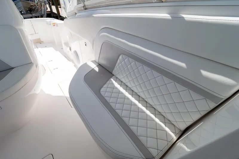  Yacht Photos Pics Luxurious seating on 2023 Intrepid 345 Valor boat, featuring elegant white upholstery.