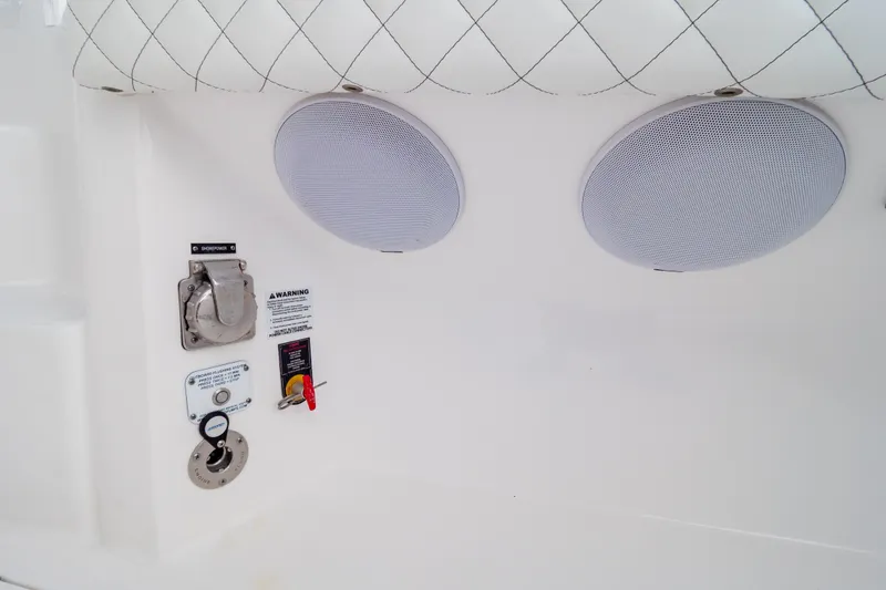  Yacht Photos Pics 2023 Intrepid 345 Valor boat interior with speakers and control panel.