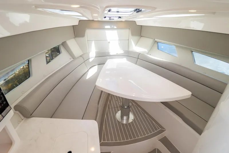  Yacht Photos Pics Luxurious interior of 2023 Intrepid 345 Valor boat with sleek seating and modern design.