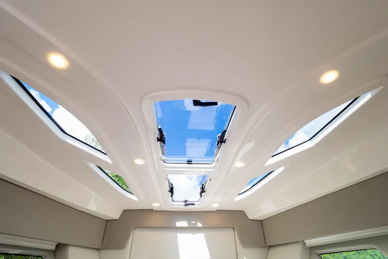  Yacht Photos Pics 2023 Intrepid 345 Valor cabin ceiling with skylights and recessed lighting.