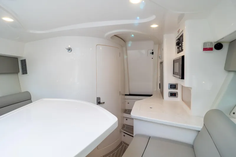  Yacht Photos Pics 2023 Intrepid 345 Valor interior with modern design and sleek white finishes.