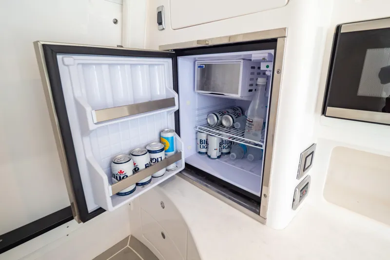  Yacht Photos Pics Mini fridge stocked with beverages on 2023 Intrepid 345 Valor boat.
